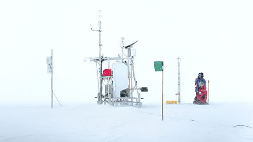 SLEIGH weather station in snowstorm on the Greenland ice sheet